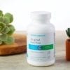 Cooper Complete Original Iron Free multivitamin and mineral formulation bottle with succulents on a counter