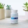 Cooper Complete Prostate Health Dietary Supplement with succulents behind