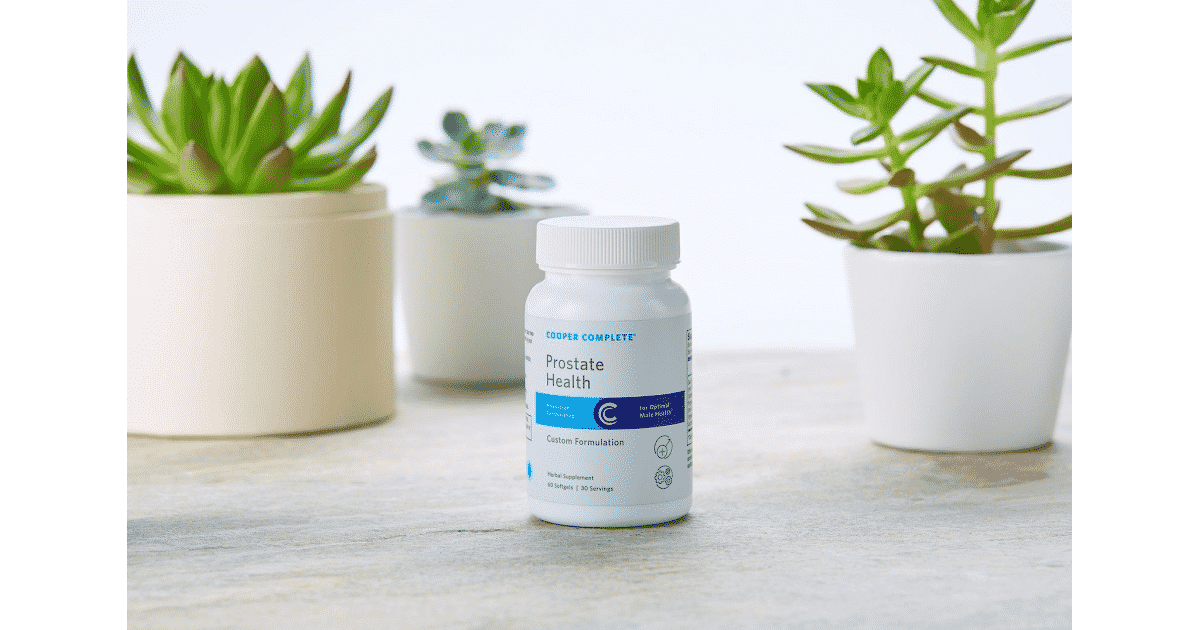 Cooper Complete Prostate Health Dietary Supplement with succulents behind