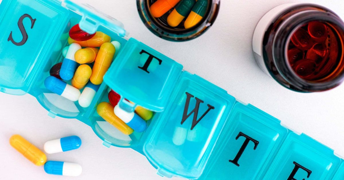 Make a habit of taking vitamins and supplements with a weekly pill container graphic