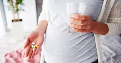 pregnant mother thinking about prenatal vitamins