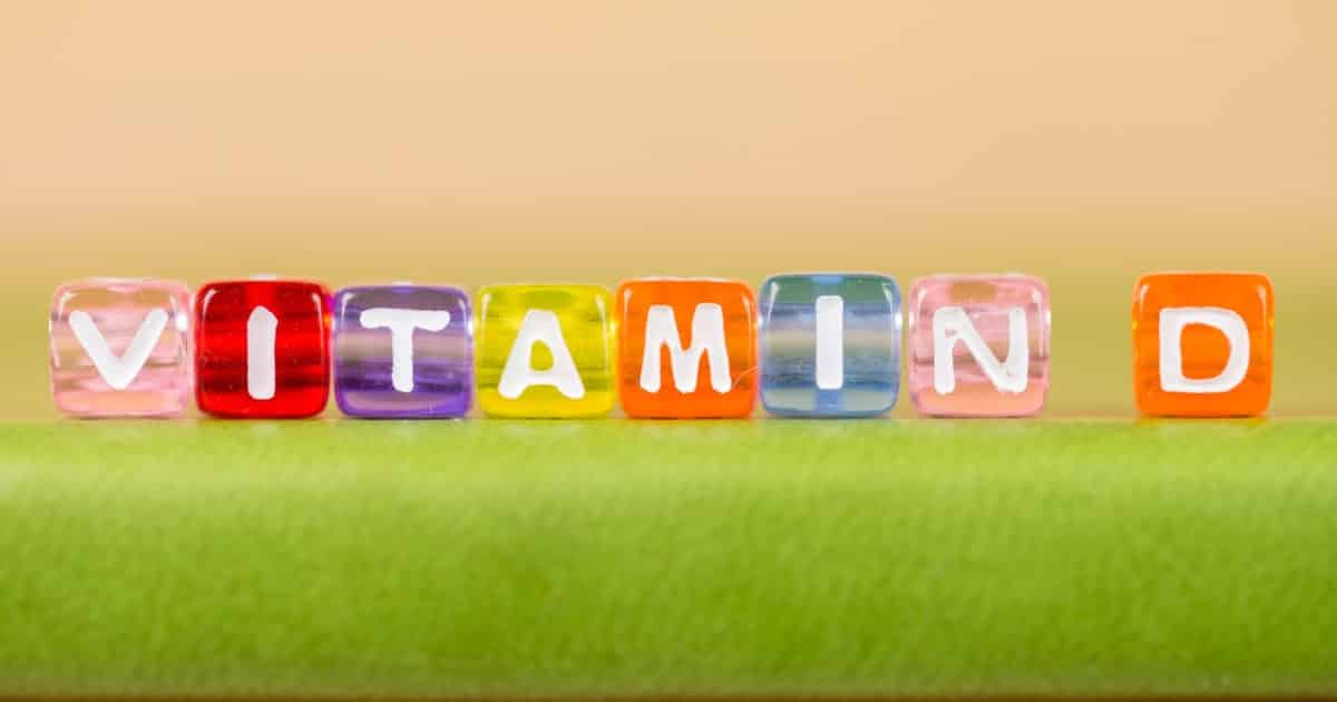 Vitamins spelled out with colored cubes