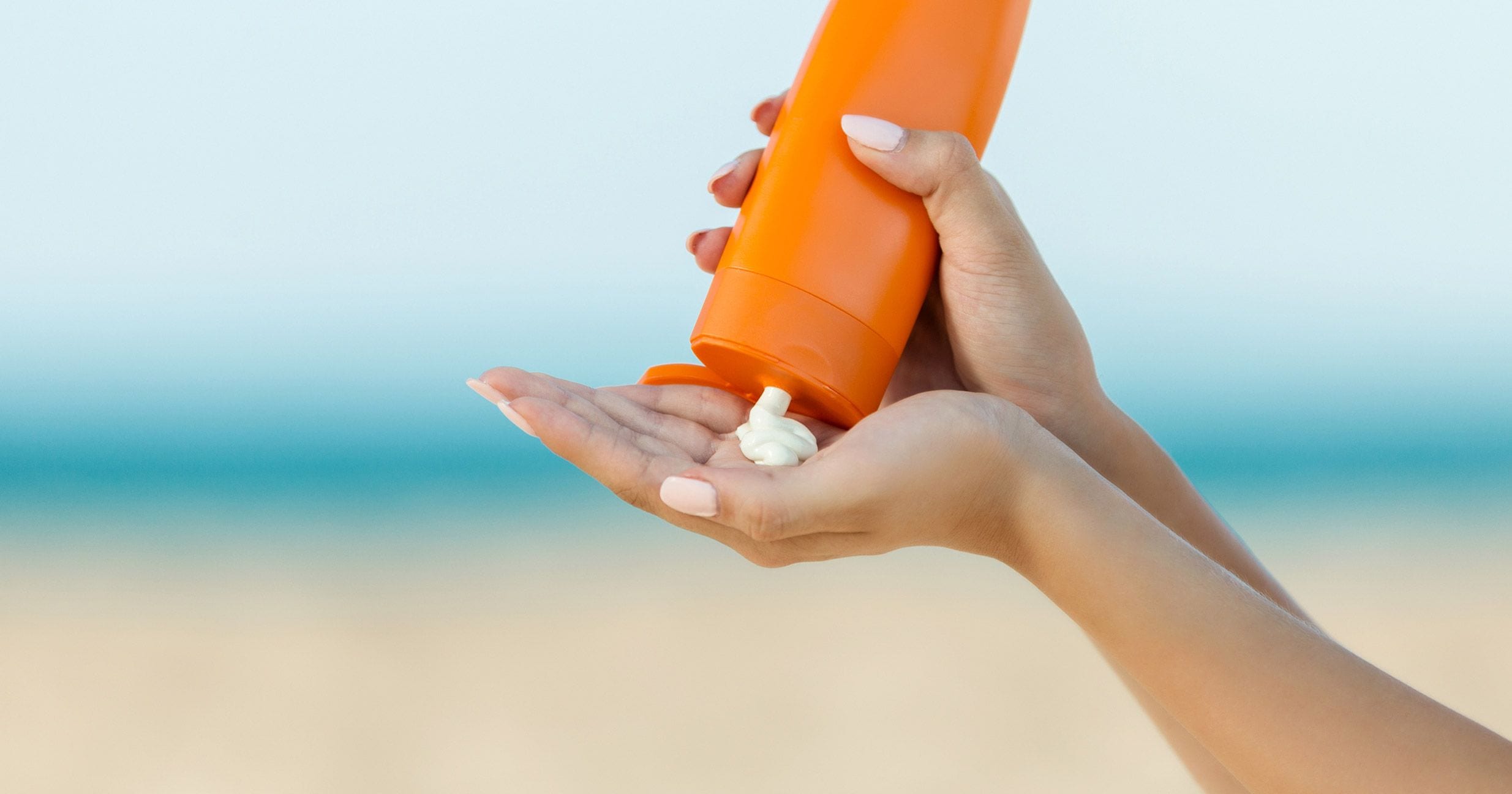 Sunscreen being applied at the beach