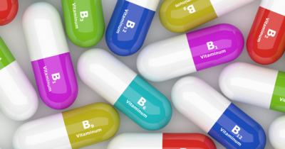 Graphic of pill capsules with the various B vitamins labeled