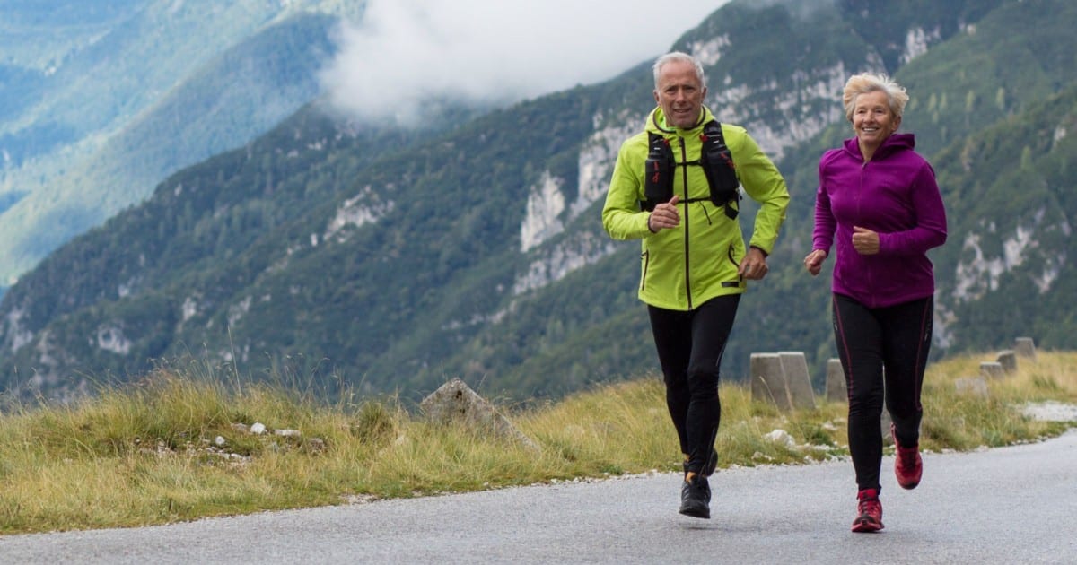 Photo of an older man jogging in the mountains. Compare Centrum vitamins to Cooper Complete Nutritional Supplements