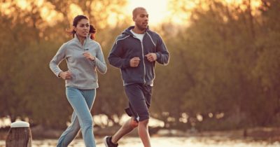 Two people jogging and enjoying a run outside