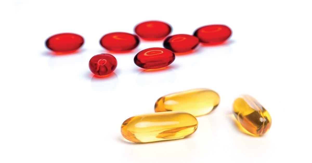 Omega-3 fish oil vs krill oil differences shown on a table beside each other