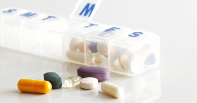 Daily pillbox with various supplements ready to put into the daily slots