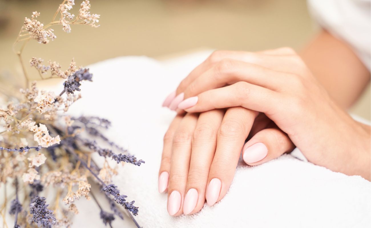 Photo of a woman's hands with beautiful skin and healthy manicured nails.