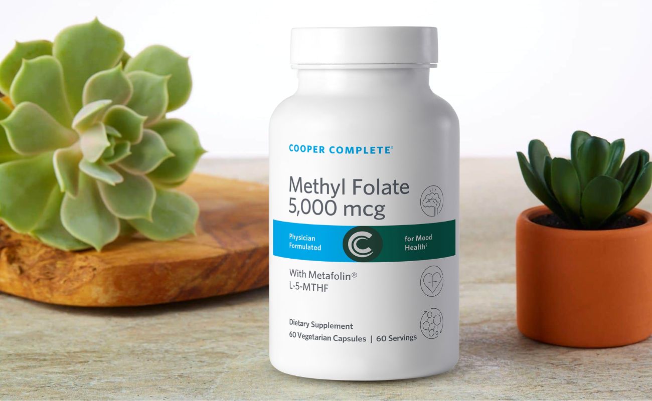 Photo of Cooper Complete Methy Folate 5000 mcg (5 mg) Supplement bottle and succulent plants