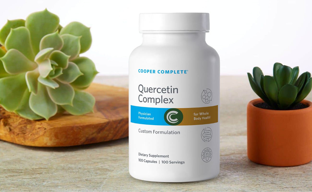 Photo of Cooper Complete Quercetin Supplement bottle and succulents.
