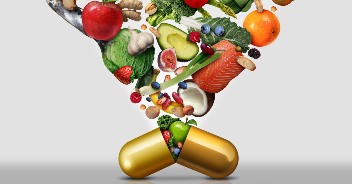 Photo of fruits, vegetables and fish cascading out of a large open capsule
