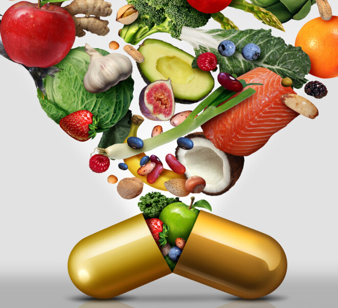 Photo of fruits, vegetables and fish cascading out of a large open capsule